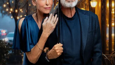 Promotional image of a smiling couple under a blue umbrella in the rain, with a city backdrop and a movie poster behind them.