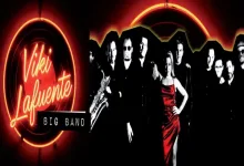 Neon sign says 'Viki Lafuente' beside a 'BIG BAND' banner; a woman in a red dress stands with a jazz band in black-and-white tones behind her.