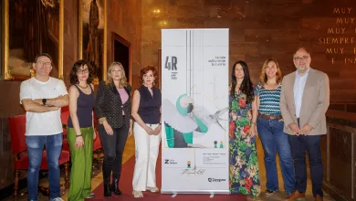 Eight Adults Stand on a Red Carpet Beside a Tall Promotional Banner for an Event 4r Mayjuly 2026 in a Marble walled Venue Zaragoza   Qué Hacer En Zaragoza Zaragozala   Qué Hacer En Zaragoza
