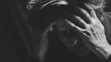 Close up Black and white Photo of a Person Holding Their Head in Distress with Large White and Green Book style Title at the Bottom Reading nacho Vegas and vidas Sempre Zaragoza   Qué Hacer En Zaragoza Zaragozala   Qué Hacer En Zaragoza