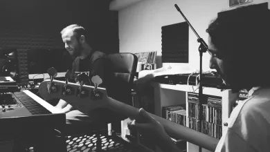 Two Musicians in a Home Studio One at a Keyboard and a Bassist in the Foreground Both Focused on Their Instruments in Monochrome Zaragoza   Qué Hacer En Zaragoza Zaragozala   Qué Hacer En Zaragoza