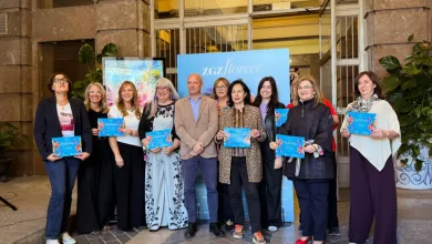 Group of People Posing with Blue Diplomas at a Ceremony Outside a Stone Building Zaragoza   Qué Hacer En Zaragoza Zaragozala   Qué Hacer En Zaragoza