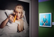 Large Photo of a Blonde Woman in a White Shirt Lying in Bed Holding an Orange Bottle with Framed Art on a Green Wall Beside Zaragoza Qué Hacer En Zaragoza Zaragozala Qué Hacer En Zaragoza