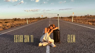 Person Sitting on an Empty Desert Highway with a Large Suitcase Posing on the Road As the Sun Sets or Rises La Zaragozana Elem Estrena estar Sin Ti Su Nuevo Single Zaragozala   Qué Hacer En Zaragoza