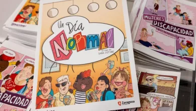 Colorful Comic Book Cover Titled un Día Normal with Diverse Cartoon Characters Cheering and Toasting Stack of Similar Comics in the Background Cómic un Día Normal Gana El Premio Sociedad Inclusiva 2026 Zaragozala Qué Hacer En Zaragoza
