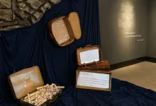 Exhibit with Vintage Suitcases Opened to Reveal Rolled Documents and a Photo Inside Arranged on Dark Blue Fabric Zaragozala | Agenda Cultural Ocio Y Planes En Zaragoza Página 1400 Zaragozala Qué Hacer En Zaragoza