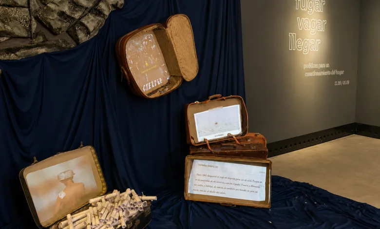 Exhibit with Vintage Suitcases Opened to Reveal Rolled Documents and a Photo Inside Arranged on Dark Blue Fabric Zaragozala | Agenda Cultural Ocio Y Planes En Zaragoza Zaragozala Qué Hacer En Zaragoza