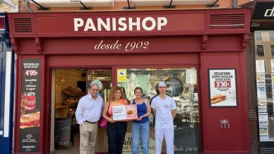 Group of Five Adults Standing in Front of a Red Panishop Bakery Storefront Posing with Donation Boxes for Briocheque Solidario El Brioche Solidario Recauda Más De 500 Euros Para Adpla Zaragozala Qué Hacer En Zaragoza