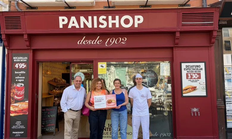 Group of Five Adults Standing in Front of a Red Panishop Bakery Storefront Posing with Donation Boxes for Briocheque Solidario El Brioche Solidario Recauda Más De 500 Euros Para Adpla Zaragozala   Qué Hacer En Zaragoza