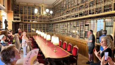 Tourists in a Grand Historic Library with a Long Redtable Brass Lamps and Gilded Glass front Bookcases Lining the Walls Las Jornadas De Puertas Abiertas De La Dpz Reúnen a Más De 400 Visitantes Zaragozala   Qué Hacer En Zaragoza