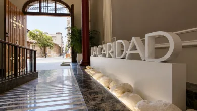 Indoor Lobby with Large White acardad Letters on a Pedestal Beside a Marble Floor and Open Wooden Doors to a Sunlit Street Zaragozala | Agenda Cultural Ocio Y Planes En Zaragoza Zaragozala   Qué Hacer En Zaragoza