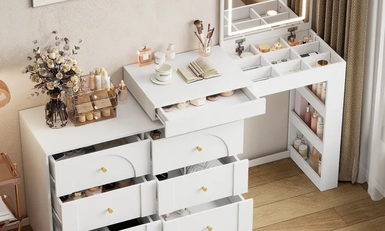 White Makeup Vanity with Open Drawers Showing Cosmetics and Brushes a Mirrored Cabinet with Led Frame and a Small Open Book on the Surface Beige Walls and Light Wood Floor Create a Chic Dressing Room Scene Muebles Multifuncionales Y Sostenibles Para Aprovechar Hasta El último Rincón Y Combatir Así El Precio Del Metro Cuadrado En Zaragoza Zaragozala   Qué Hacer En Zaragoza