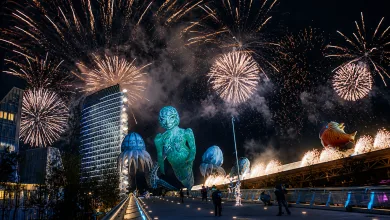 Night Scene at a Futuristic Sculpture Park with Glowing Blue Statues and a Fireworks Display Overhead 18 Años De La Expo 2008 El Evento Que Transformó Zaragoza Zaragozala Qué Hacer En Zaragoza
