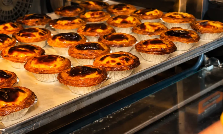 Rows of Golden Custard Tarts on a Baking Tray Inside an Industrial Oven Pasteles De Nata Abre Natas Douro En Zaragoza Zaragozala Qué Hacer En Zaragoza