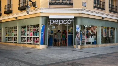 Storefront of a Pepco with Shoppers Entering the Glass Doors Pastel Yellow Building and Colorful Clothes in the Windows on a Sunny Street Corner Pepco Abre En La Calle Alfonso Su Nueva Tienda En Zaragoza Zaragozala   Qué Hacer En Zaragoza