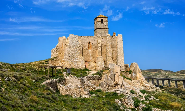 Ruined Stone Castle on a Grassy Hill Under a Bright Blue Sky Rodén Viejo El Pueblo Que La Guerra Civil Dejó Suspendido En El Tiempo Zaragozala Qué Hacer En Zaragoza