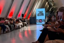 Audience Seated Along a Glossy Runway in a Futuristic Venue with Red Wall Wash a Large Blue Screen Reading sub Velo Near a Speaker Stage Zaragozala | Agenda Cultural Ocio Y Planes En Zaragoza Página 428 Zaragozala Qué Hacer En Zaragoza