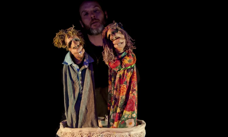 Puppeteer Holds Two Handmade Puppets with Yarn Hair in Front of a Dark Background Performing a Puppet Show Harinera Zgz Inicia Su Programación De Verano Zaragozala   Qué Hacer En Zaragoza