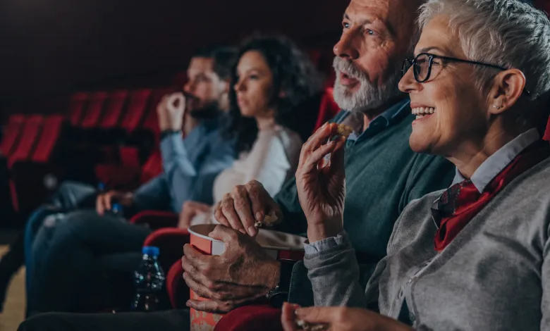 Smiling Elderly Woman with Short White Hair and Glasses Eats Popcorn in a Movie Theater Seated with Others in Red Seats Zaragozala | Agenda Cultural Ocio Y Planes En Zaragoza Página 1424 Zaragozala Qué Hacer En Zaragoza