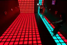 People Standing on a Glowing Grid of Red Led Floor Tiles with a Turquoise Strip Along the Right Edge in a Dark Room Zaragozala | Agenda Cultural Ocio Y Planes En Zaragoza Zaragozala   Qué Hacer En Zaragoza