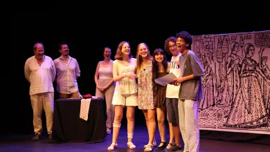 Eight Young Performers Stand in a Line on Stage Smiling a Table with a Polka dot Cloth and a Large Illustrated Backdrop Behind Them Muestra De Teatro Amateur De Arbolé Premia a Sus Ganadores Zaragozala Qué Hacer En Zaragoza