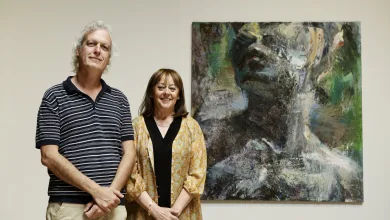 Man and Woman Stand Side by Side in a Gallery Posing in Front of a Large Abstract Painting As the Word gran Premio Appears on the Wall Above Themy Zaragozala | Agenda Cultural Ocio Y Planes En Zaragoza Zaragozala   Qué Hacer En Zaragoza