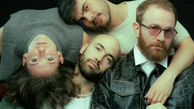 Four Men Lie or Lean Close Together Heads Together Looking at the Camera with a Neutral or Relaxed Expression Against a Dark Background Inverfest Zaragoza 2027 Suma Cinco Nuevos Conciertos Zaragozala Qué Hacer En Zaragoza