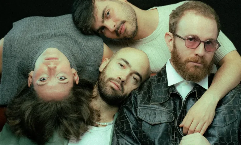 Four Men Lie or Lean Close Together Heads Together Looking at the Camera with a Neutral or Relaxed Expression Against a Dark Background Inverfest Zaragoza 2027 Suma Cinco Nuevos Conciertos Zaragozala Qué Hacer En Zaragoza