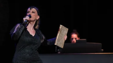 Female Singer on a Dark Stage Mic in Hand Wearing a Sequined Black Dress and a Decorative Headpiece While Performing Zaragozala | Agenda Cultural Ocio Y Planes En Zaragoza Zaragozala   Qué Hacer En Zaragoza