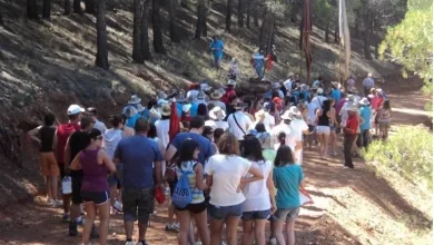 Large Group of People Outdoors on a Forest Trail Gathered and Waiting in a Line Along a Dirt Path Munébrega Celebra El Ton De San Cristobal Este Domingo Zaragozala   Qué Hacer En Zaragoza