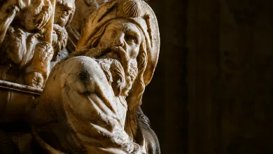 Close up of a Marble Statue Bearded Man with a Hood Lit from the Left Against a Dark Background Busto De Santiago Apóstol En El Pilar Fechas Y Visita Zaragozala Qué Hacer En Zaragoza