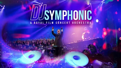 Conductor Raises Arms on a Stage with a Full Orchestra and a Dj Deck Under Neon Purple and Blue Lights with a dj Symphonic Banner Above Dj Symphonic En Zaragoza 2026 Entradas Y Precios Zaragozala Qué Hacer En Zaragoza