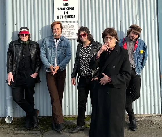 Five member Rock Band Posing Against a Corrugated Metal Wall Under a no Smoking in Net Sheds Sign Wearing Denim and Leather Jackets and Sunglasses Flamin Groovies En Zaragoza Concierto Por Sus 60 Años Zaragozala Qué Hacer En Zaragoza