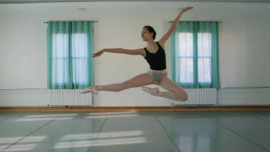 Ballet Dancer in a Black Leotard and Light Shorts Mid leap in a Bright Studio with Teal Curtains Behind Her Zaragozala | Agenda Cultural Ocio Y Planes En Zaragoza Zaragozala   Qué Hacer En Zaragoza