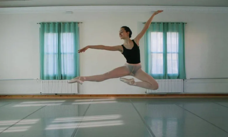 Ballet Dancer in a Black Leotard and Light Shorts Mid leap in a Bright Studio with Teal Curtains Behind Her El Conservatorio De Danza De Zaragoza Abre 67 Plazas Fechas Y Cómo Solicitar Una Zaragozala   Qué Hacer En Zaragoza