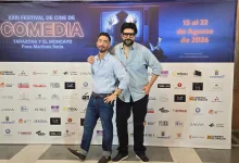 Two Men in Light Blue Shirts Pose with an Arm Around Each Other in Front of a Large Film Festival Banner Reading xxiii Festival De Cine De Comedia in Tarazona Y El Moncayo 2026 Poster Behind Them Zaragozala | Agenda Cultural Ocio Y Planes En Zaragoza Zaragozala Qué Hacer En Zaragoza