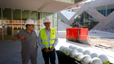 Two Construction Workers Wearing White Hard Hats and a High visibility Vest Stand Near a Row of Safety Helmets at a Building Construction Site El Centro Cívico Hispanidad Encara Su Recta Final Abrirá a Principios De 2027 Zaragozala   Qué Hacer En Zaragoza