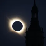 Silhouette of a Tall Clock Tower Against a Deep Blue Sky During a Solar Eclipse with the Suns Corona Forming a Bright Ring Around the Dark Disk of the Moon Miles De Personas Observan El Eclipse Total En Zaragoza Zaragozala Qué Hacer En Zaragoza