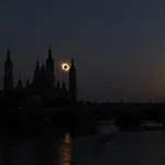 Silhouette of Ornate Church Towers Against a Sunset with a Solar Eclipse Behind One Spire over a River Miles De Personas Observan El Eclipse Total En Zaragoza Zaragozala Qué Hacer En Zaragoza